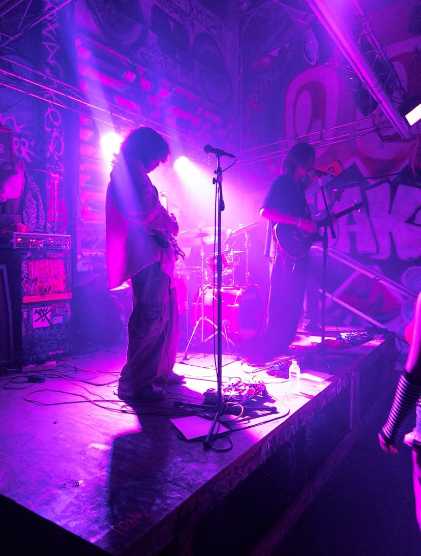 A band performing live at a Music Creative show